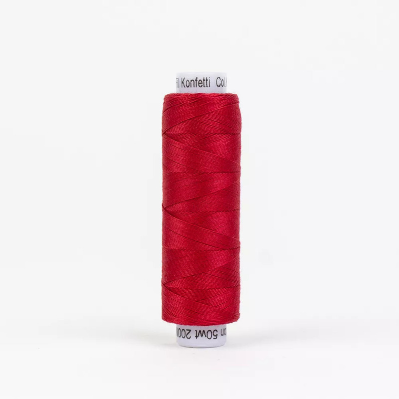 Spool of KT302 Christmas Red thread, isolated on a white background