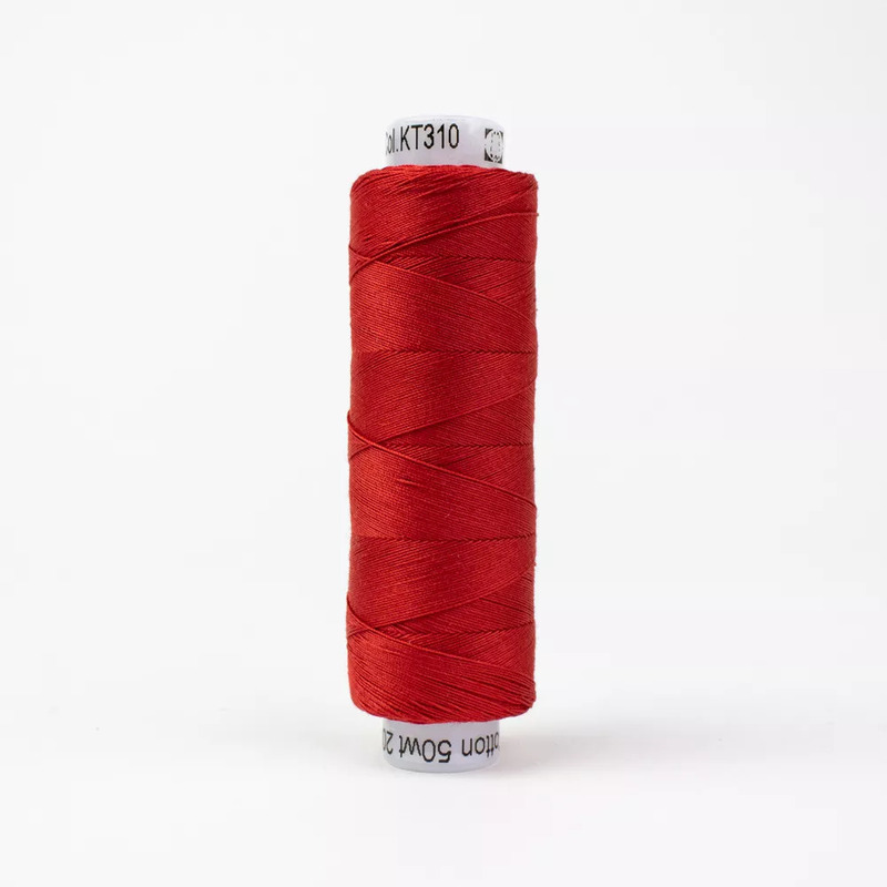 Spool of KT310 Cherry thread, isolated on a white background