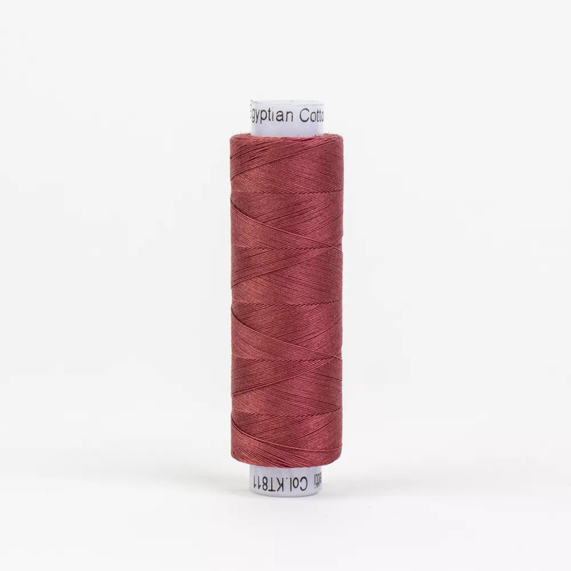 Spool of KT811 Barn Red thread, isolated on a white background