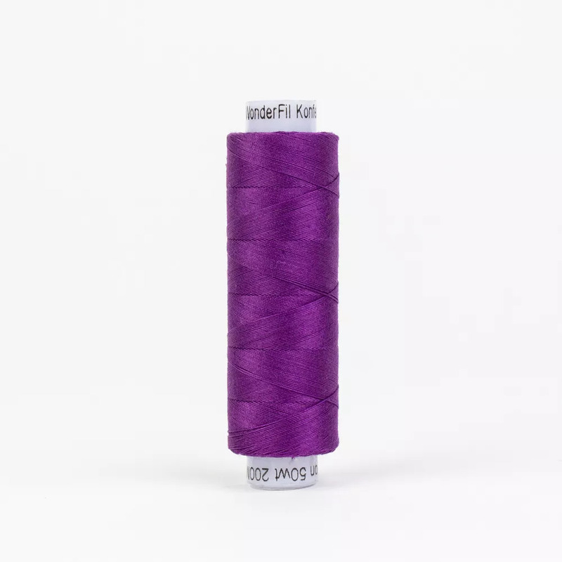 Spool of KT605 Purple thread, isolated on a white background