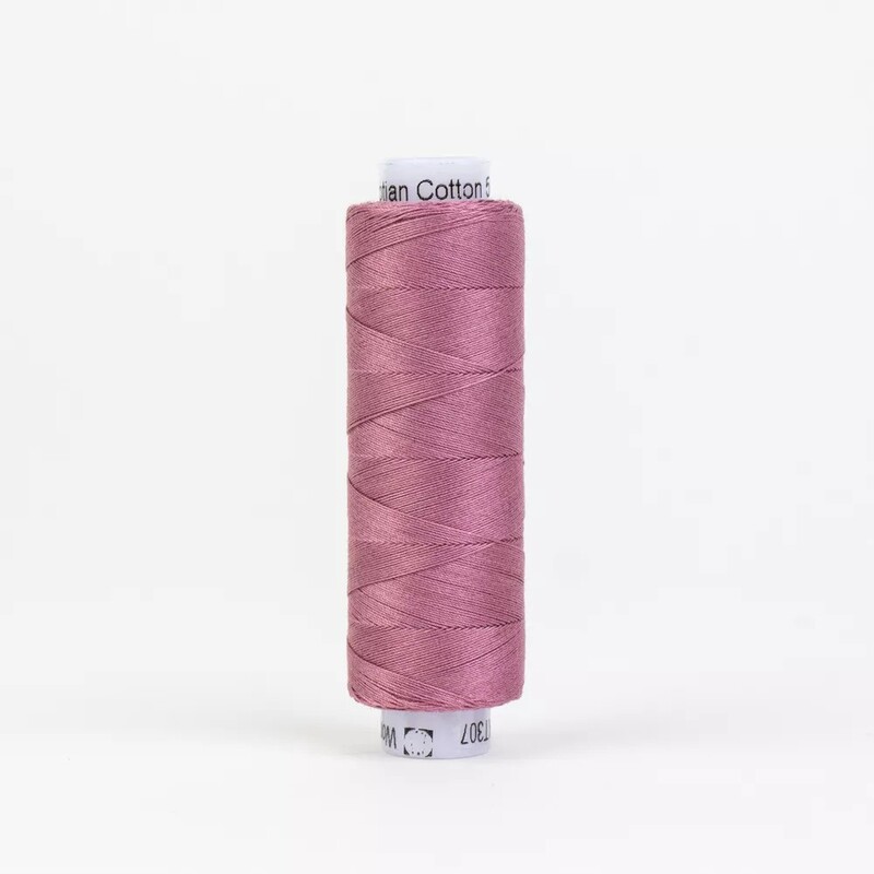 Spool of KT307 Dusty Plum thread, isolated on a white background