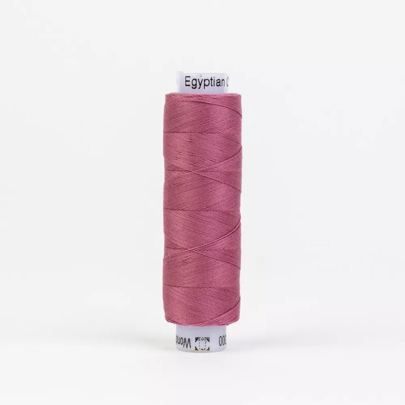 Spool of KT300 Rose thread, isolated on a white background