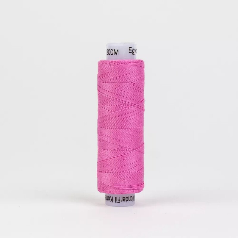 Spool of KT308 Carnation Pink, isolated on a white background
