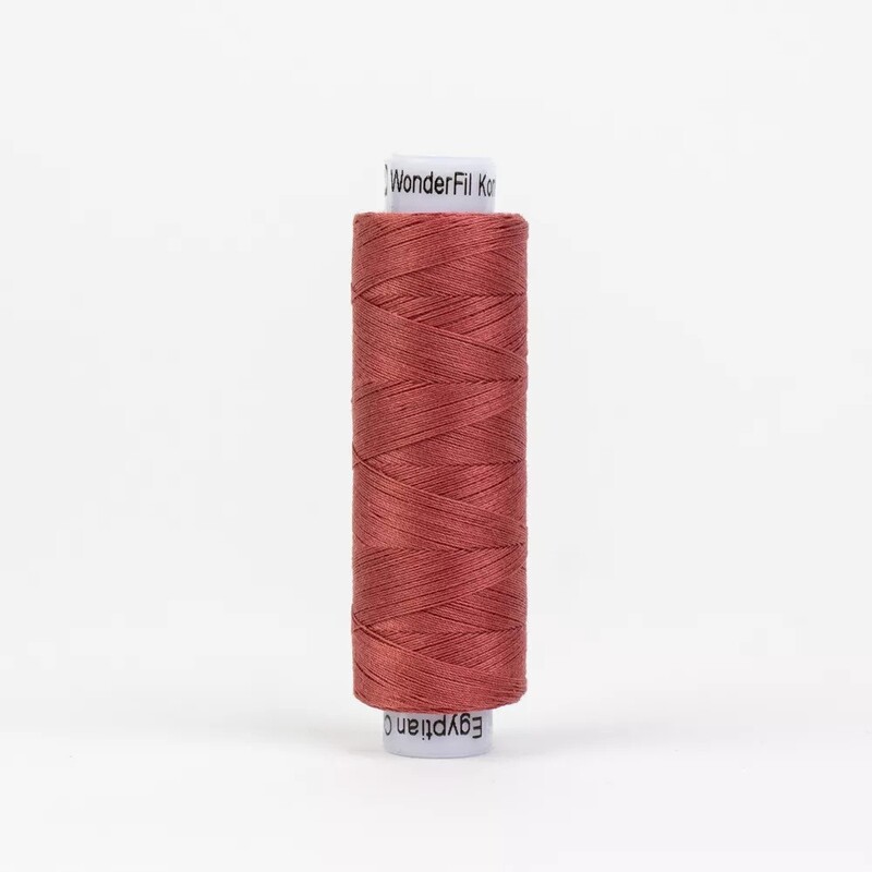 Spool of KT304 Drab Rose, isolated on a white background