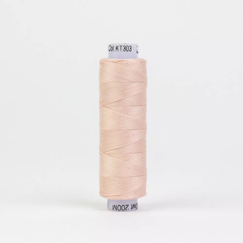 Spool of KT303 Baby Pink, isolated on a white background