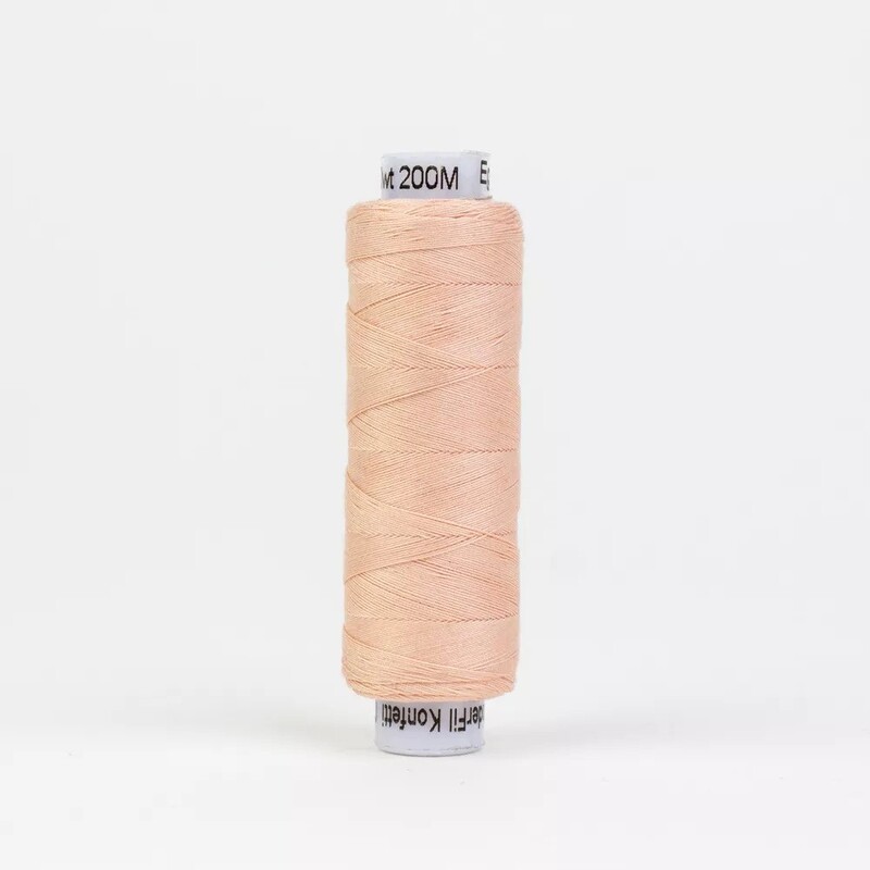 Spool of KT306 Soft Pink, isolated on a white background