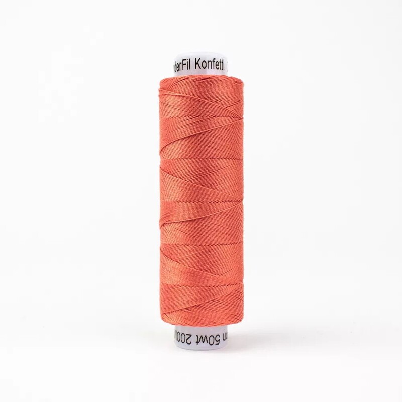 Spool of KT418 Salmon, isolated on a white background