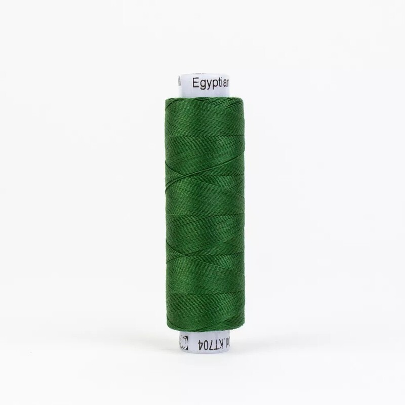 Spool of KT704 Dark Christmas Green isolated on a white background