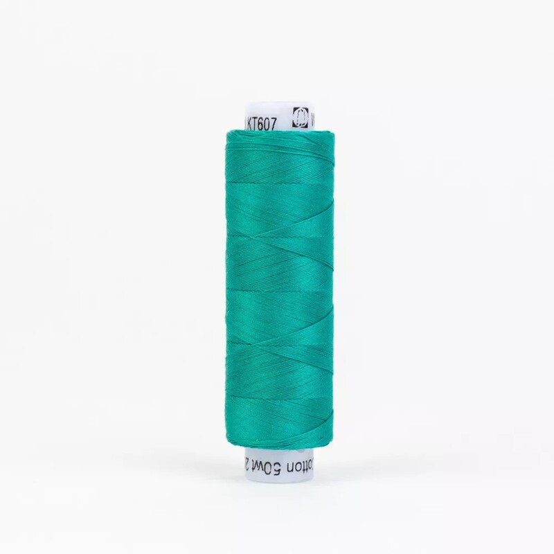 Spool of KT607 Teal isolated on a white background