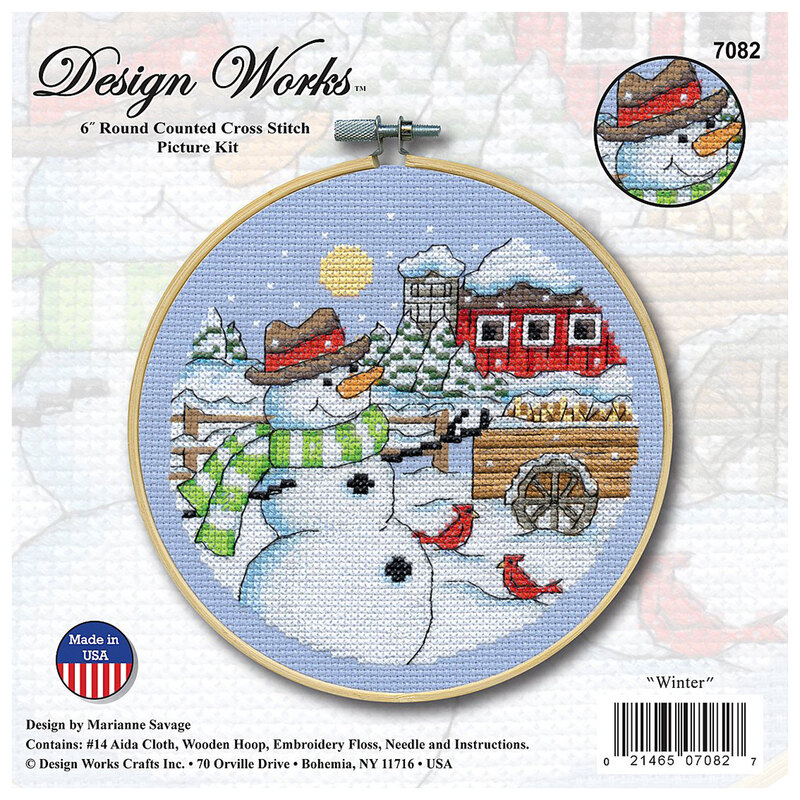 The front of the cross stitch kit featuring a picture of the finished cross stitch with a jolly snowman and his bird friends in a snowy town in a wooden hoop.