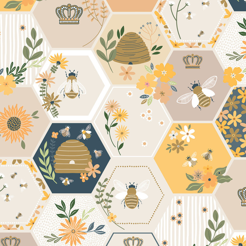 Multicolored fabric sorted in neutral, blue, and yellow honeycombs with scattered bee motifs.