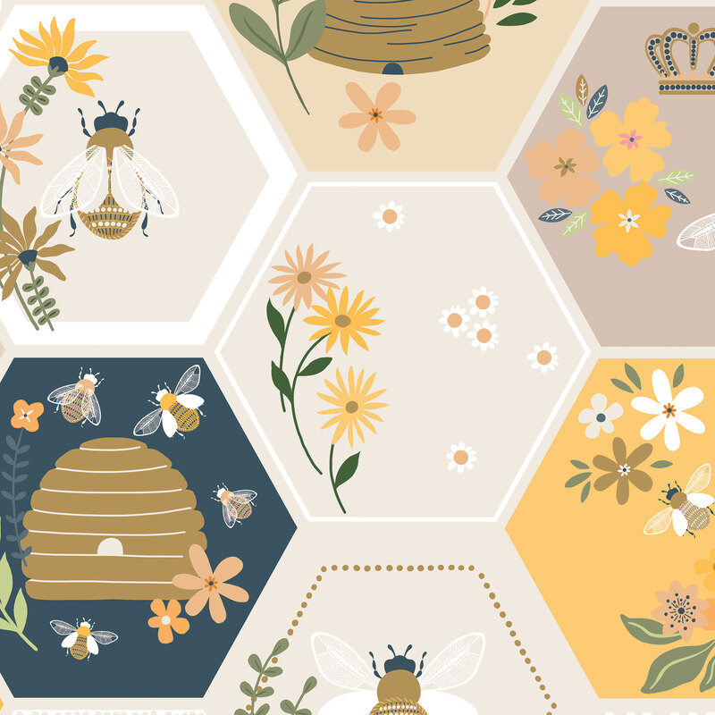 Multicolored fabric sorted in neutral, blue, and yellow honeycombs with scattered bee motifs.