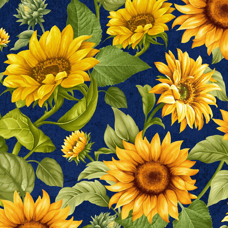 A dark navy blue fabric with large yellow sunflowers and green leaves throughout