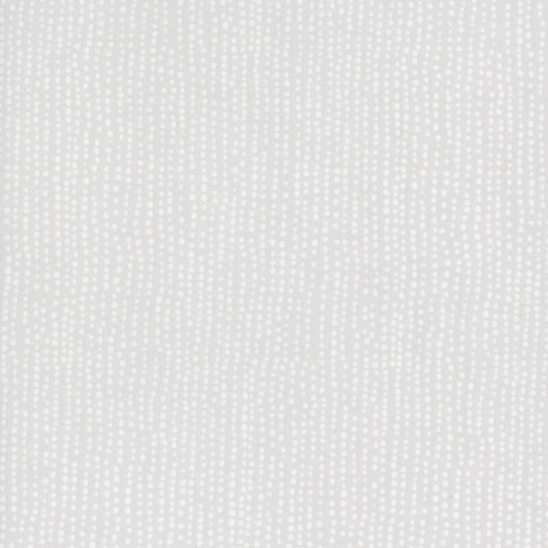 Light gray fabric with irregular lines of small white dots close together