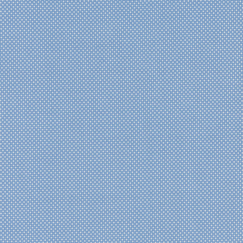 Blue fabric with alternating rows of tightly packed-together small and slightly larger circles.