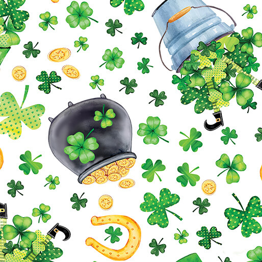 White fabric featuring shamrocks, a pot of gold, horseshoes, and other St Patricks Day motifs