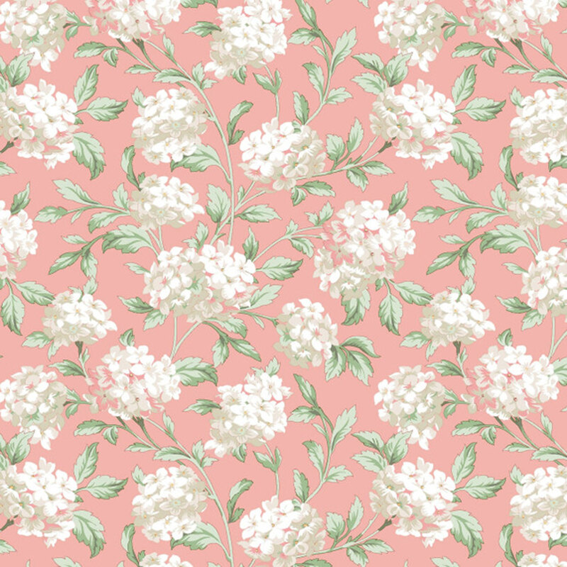 A swatch of pink fabric with scattered bunches of pinkish white hydrangea flowers.