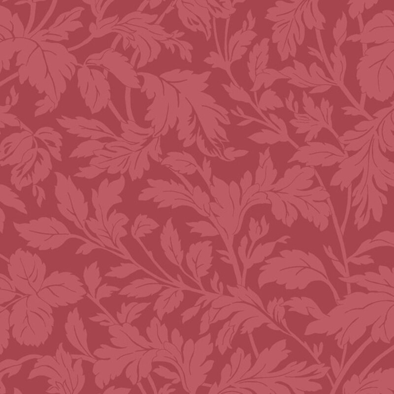 A swatch of tonal red fabric with branching leaves and stems.