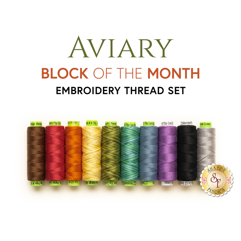 A row of coordinating thread spools, arranged in rainbow order below a text graphic that reads, 