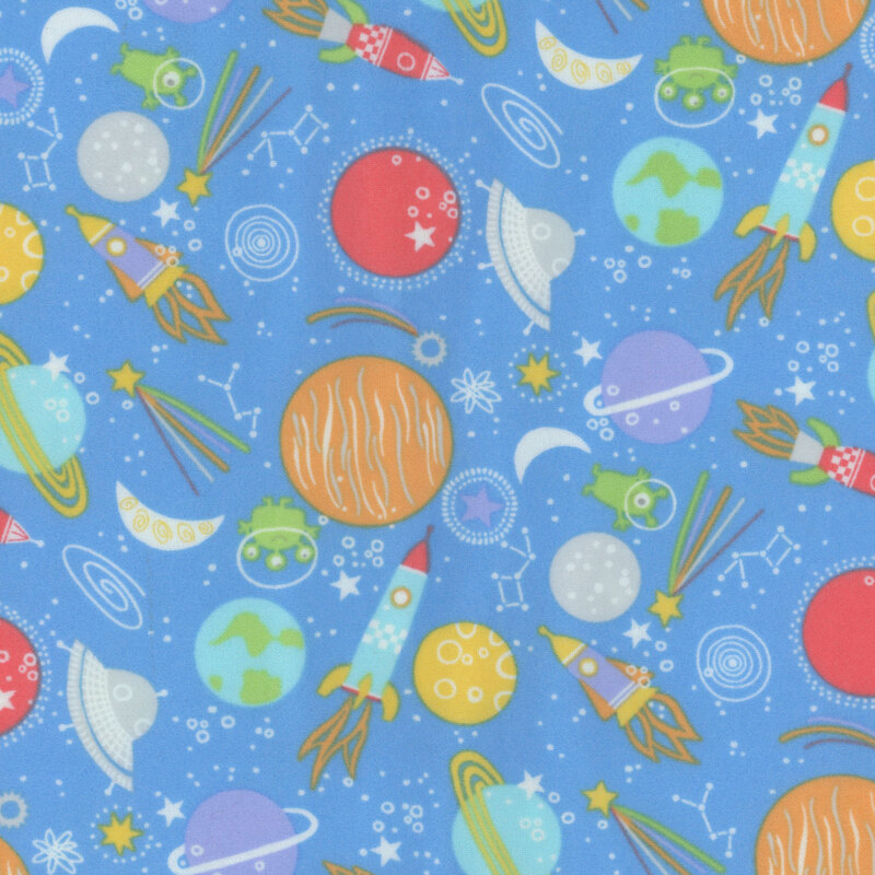blue fabric featuring planets, rockets, spaceships, and stars