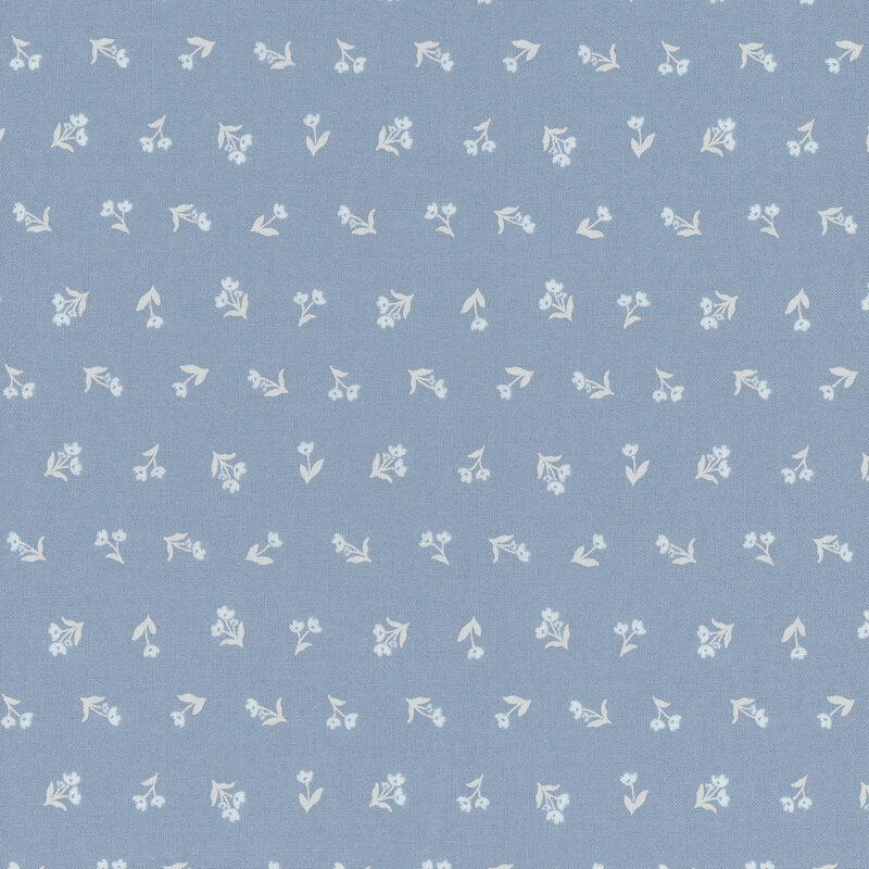 Medium blue fabric with outlines of off white florals with stems in a ditsy pattern