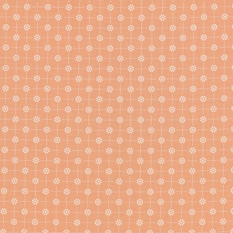 Peach colored fabric with white dotted florals arranged in a polka dot pattern connected by thin lines