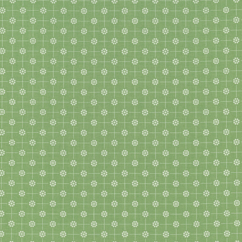Green fabric with white dotted florals arranged in a polka dot pattern connected by thin lines