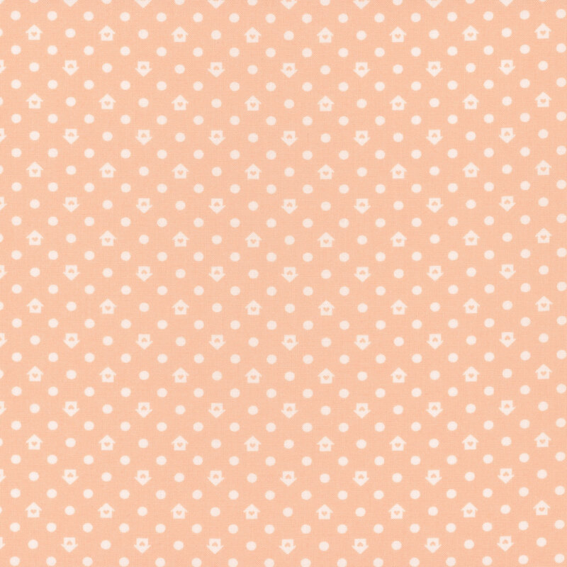 Peach fabric with a white house and dot pattern
