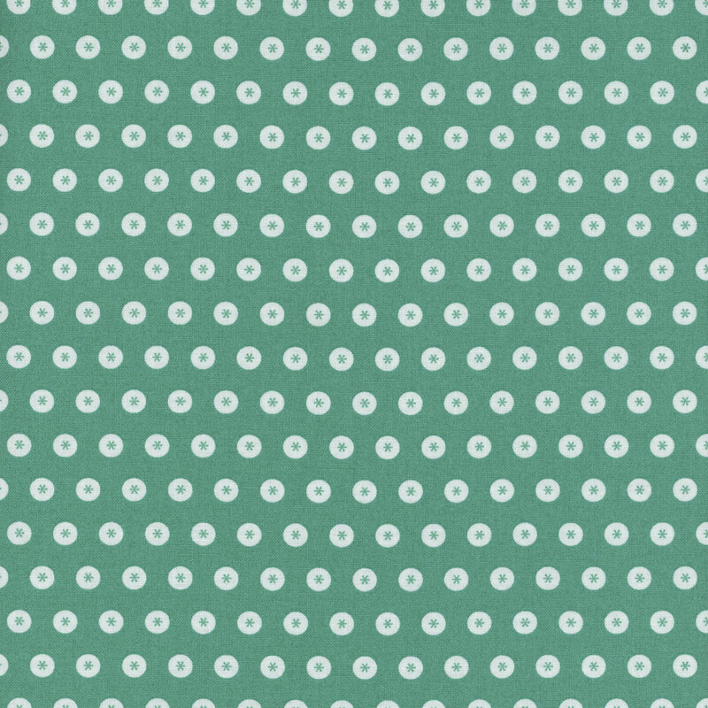 Teal fabric with neat rows of white circles with asterisks in the center.