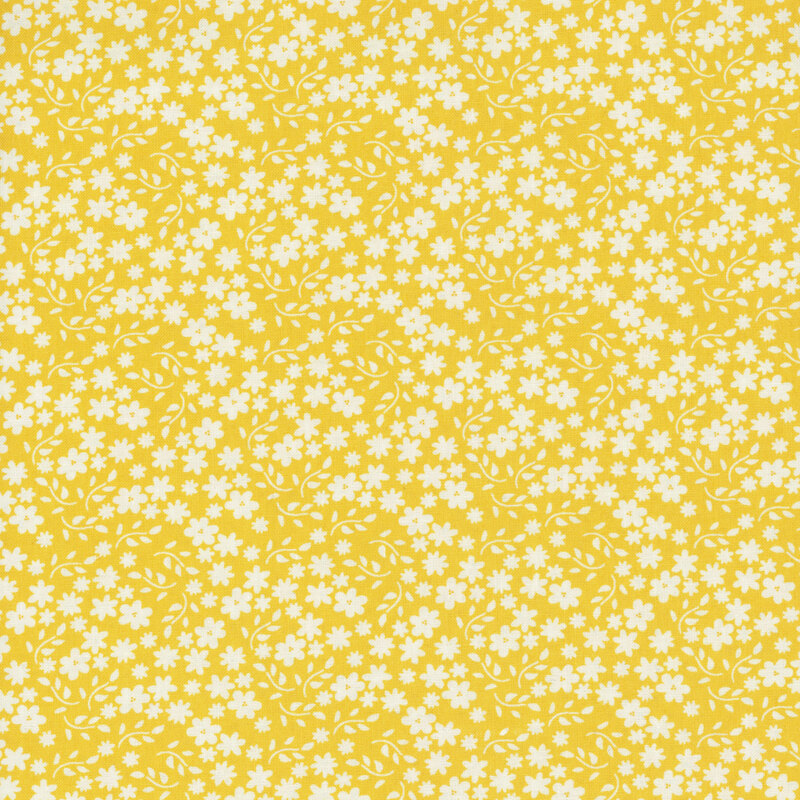 Bright yellow fabric with scattered solid white flowers and branching leaves.