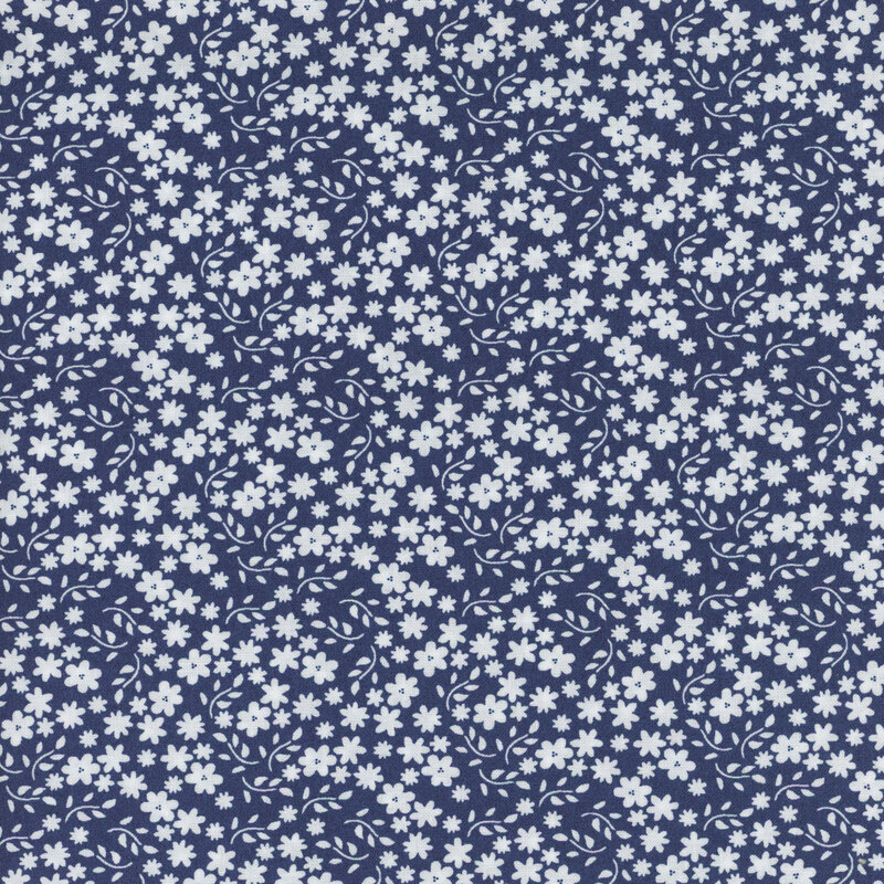 Navy fabric with scattered solid white flowers and branching leaves.