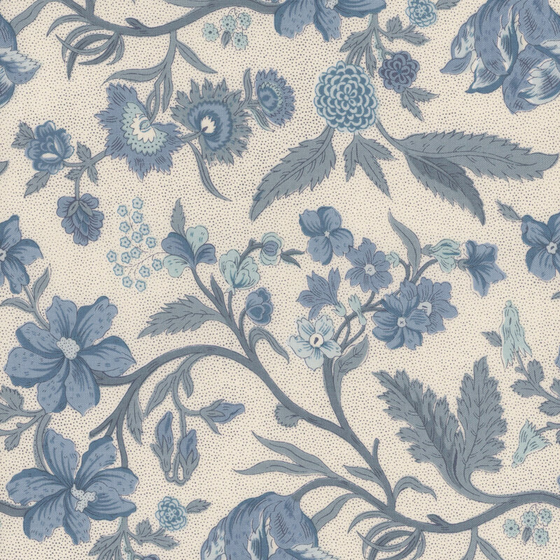 Cream fabric featuring blue sprawling vines with leaves and flowers