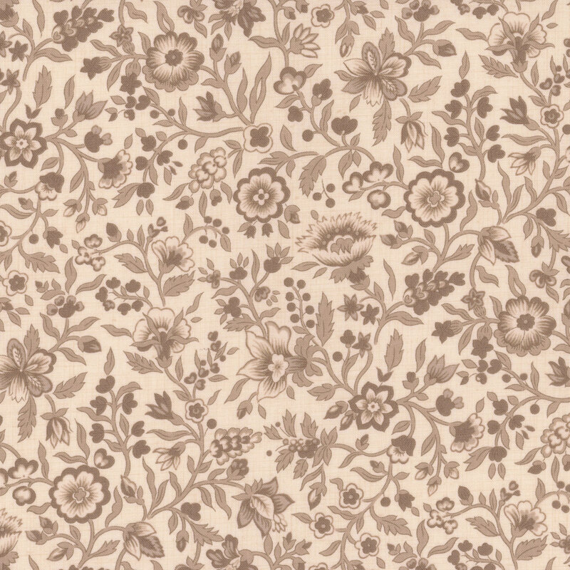 Cream fabric packed with brown leaves, vines, and florals