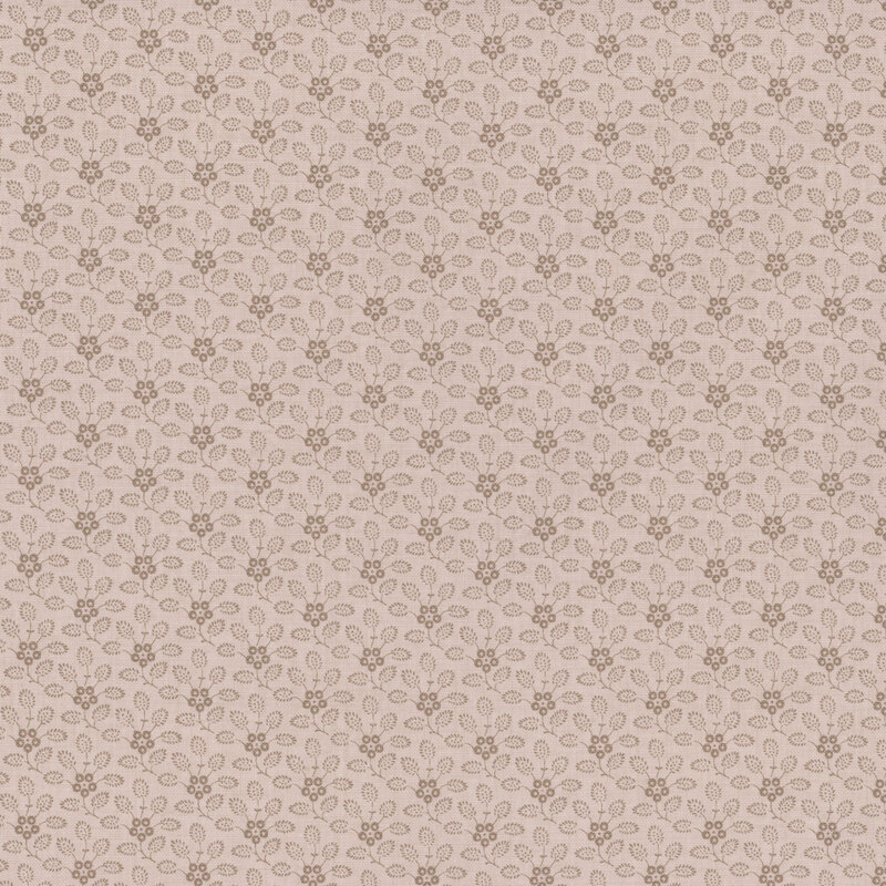 Tonal cream fabric featuring a delicate floral pattern