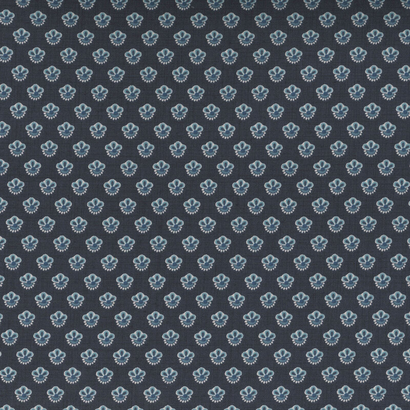 Dark blue fabric featuring an arranged pattern of stylized flowers