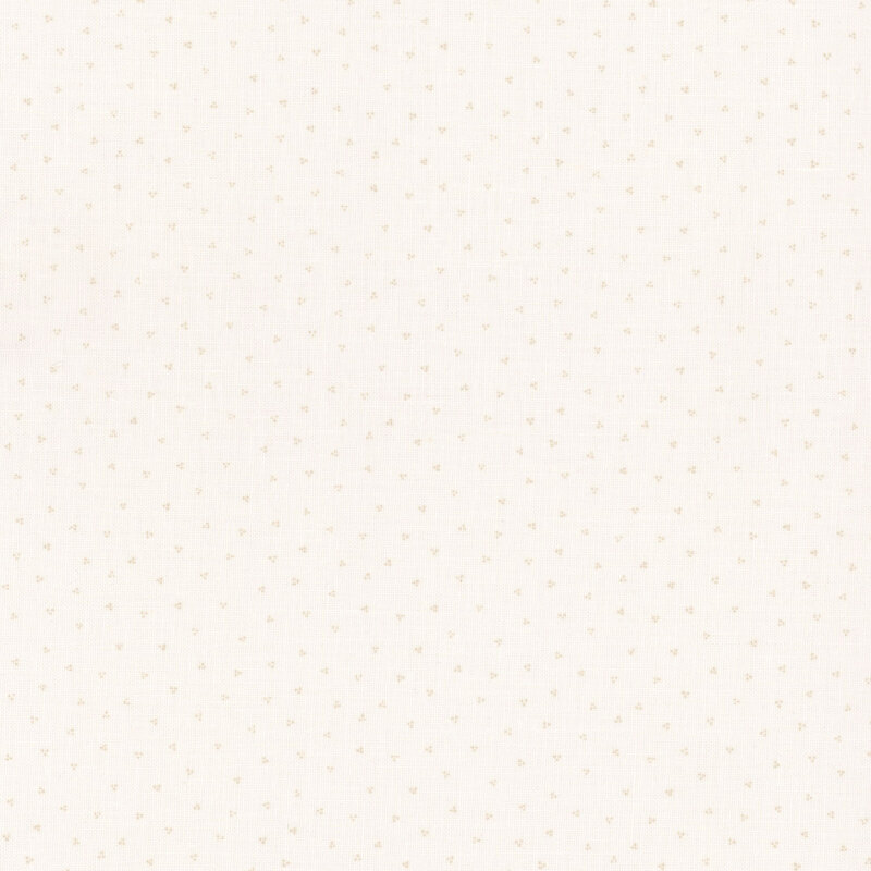 Cream fabric with a tonal ditzy dotted pattern