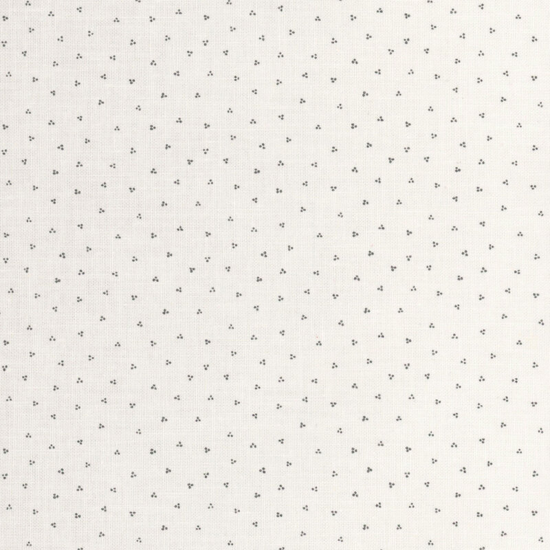 Cream fabric with a grey dotted pattern