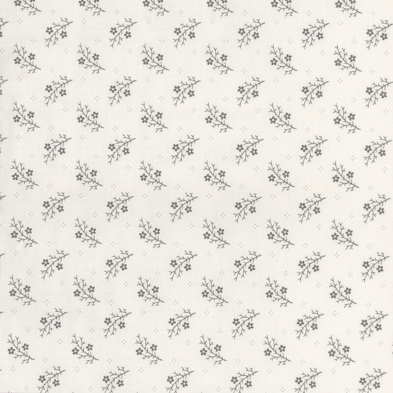 White fabric with a grey tossed floral pattern 