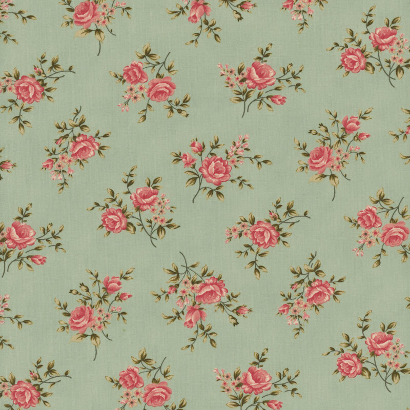 A swatch of muted aqua blue fabric with tossed bouquets of pink roses and leaves.