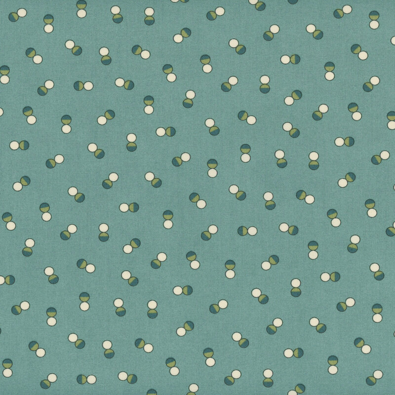 Teal blue fabric with tossed pairs of white and dark green dots in random orientations