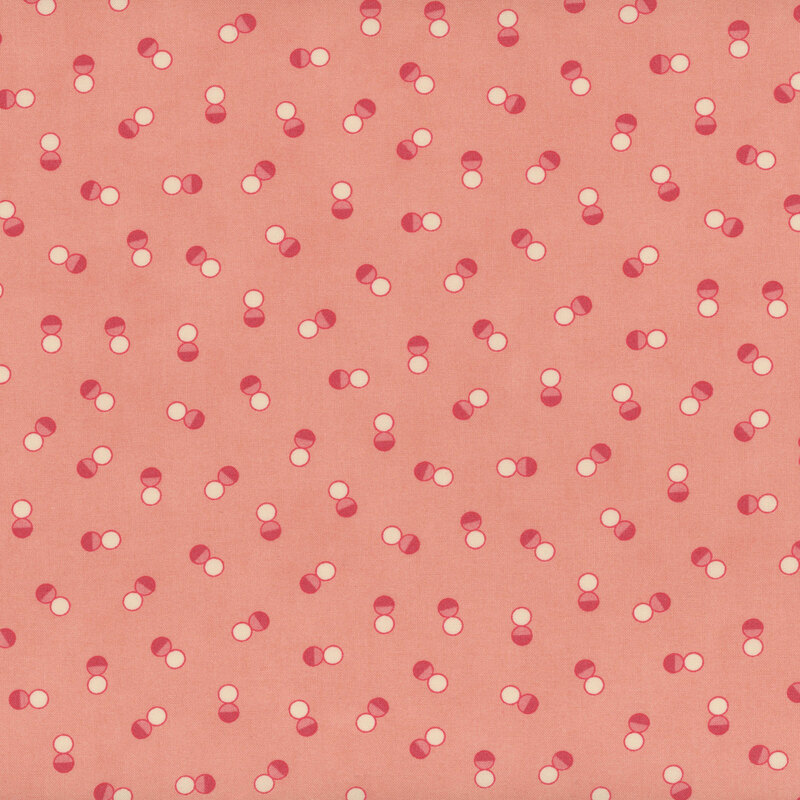 Pink fabric with tossed pairs of dark pink and white dots in random orientations