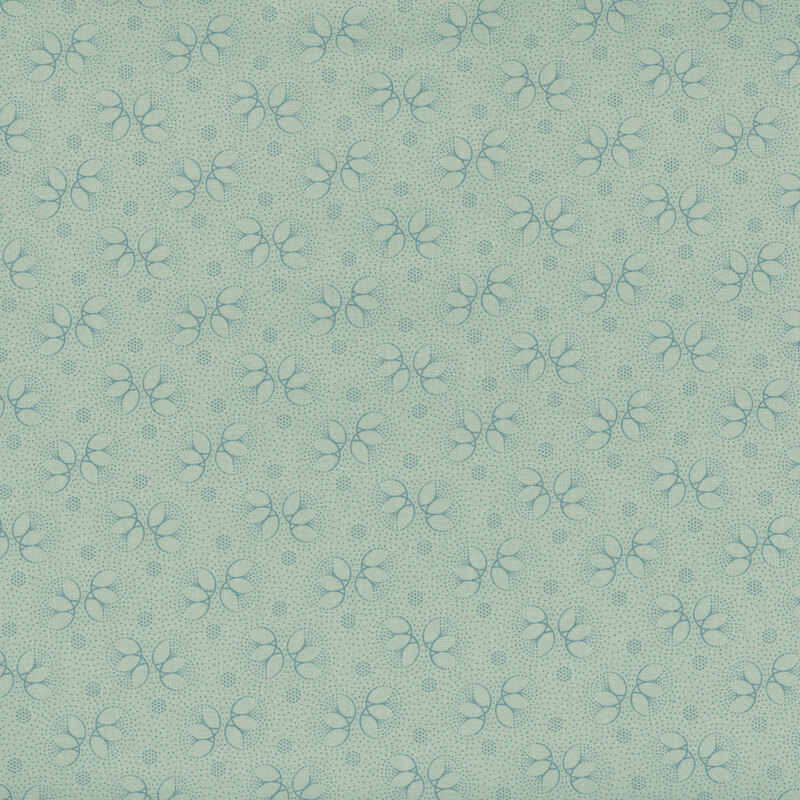 light blue fabric with darker blue floral accents and dots throughout