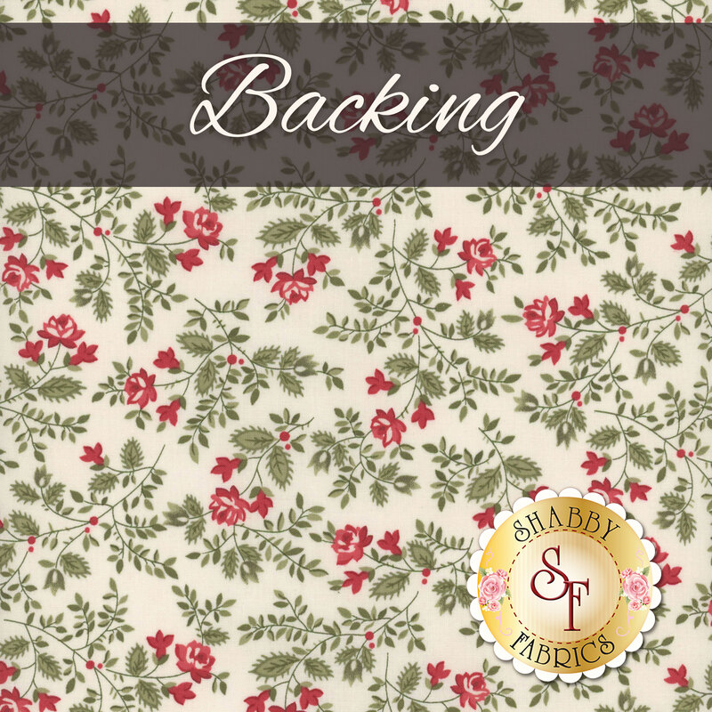 A cream fabric with green leaves and red roses with a dark banner at the top saying 