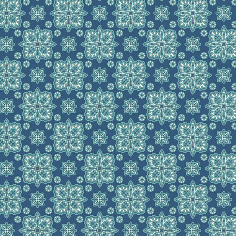 Denim blue fabric with geometric floral shapes creating a checker-like pattern