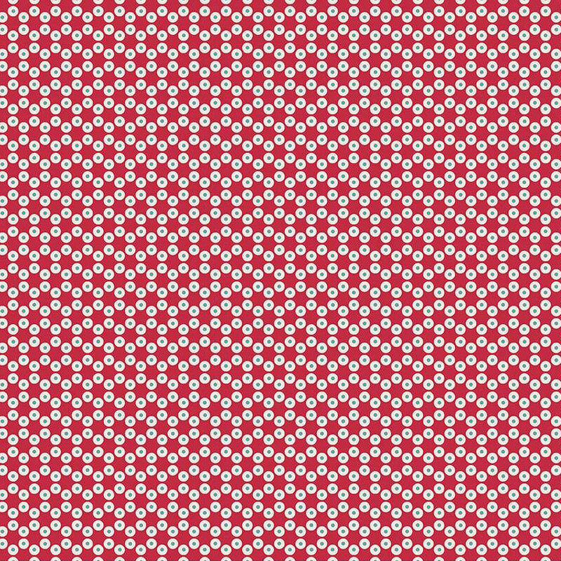 Barn red fabric with small circular dots making a connected hexagon pattern throughout