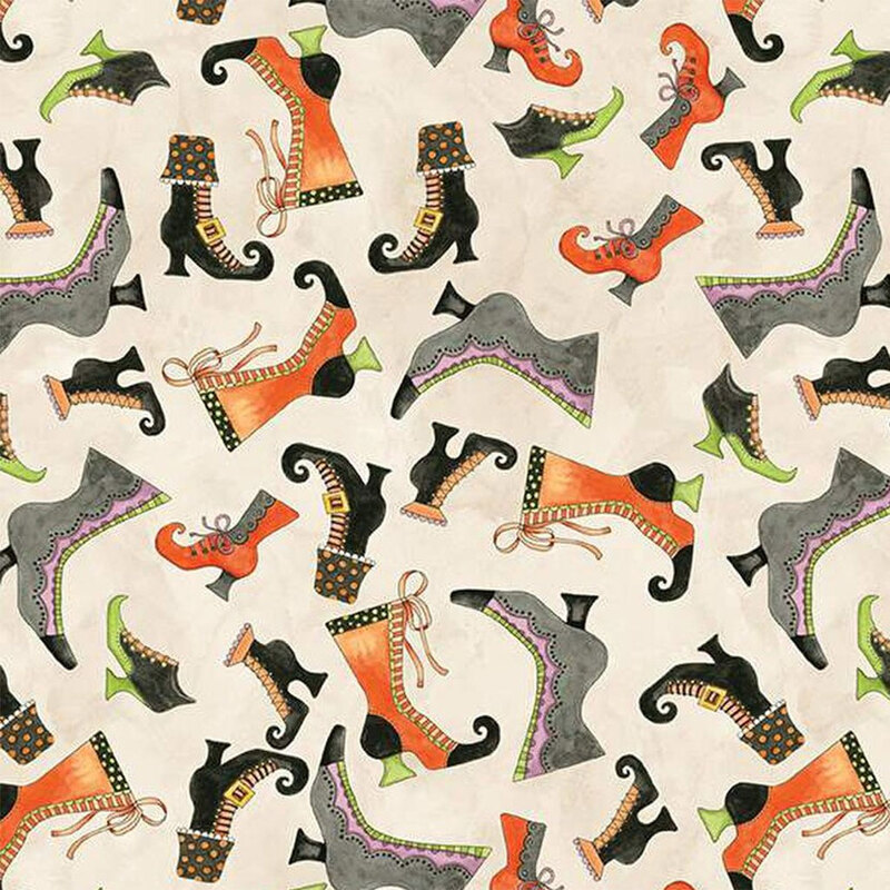 Mottled cream fabric with tossed Halloween boots 