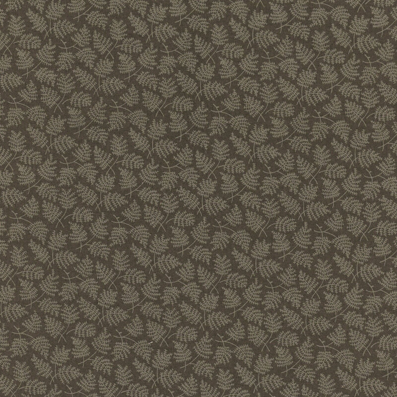 Brown fabric with a tonal fern pattern scattered across the foreground