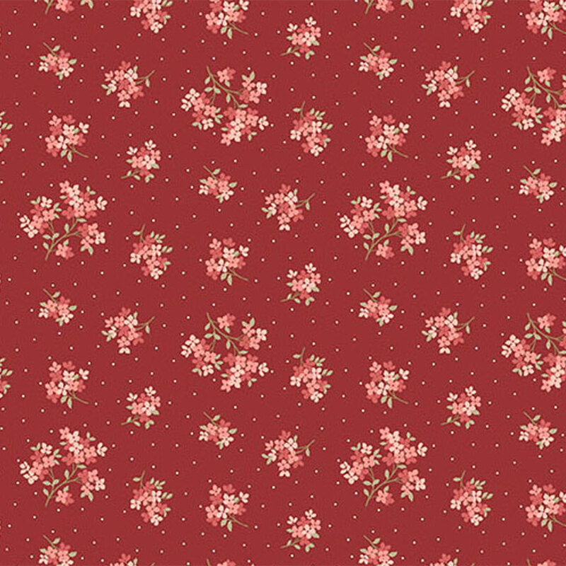 Red fabric featuring a pattern of floral clusters