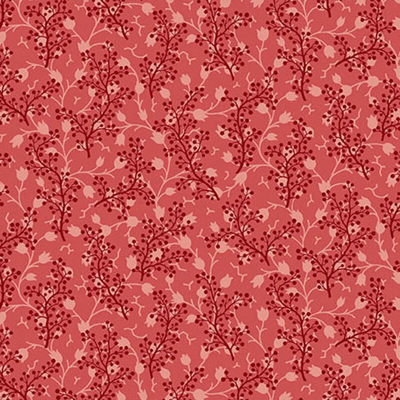 Tonal red fabric featuring a pattern of scattered sprigs intertwined with delicate floral vines