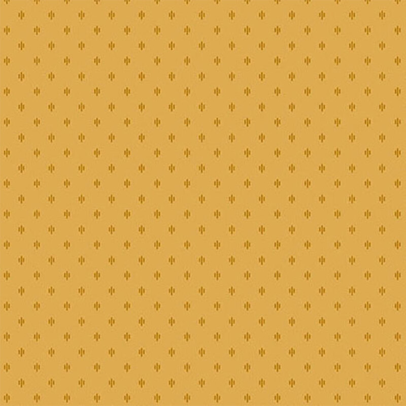 A golden yellow fabric with tonal geometric clusters